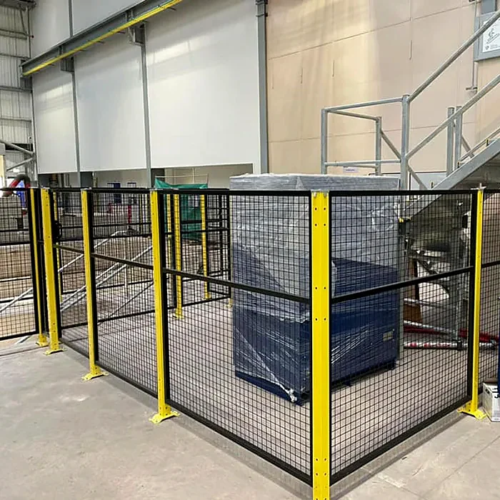 Black mesh perimeter guarding fitted around production machinery