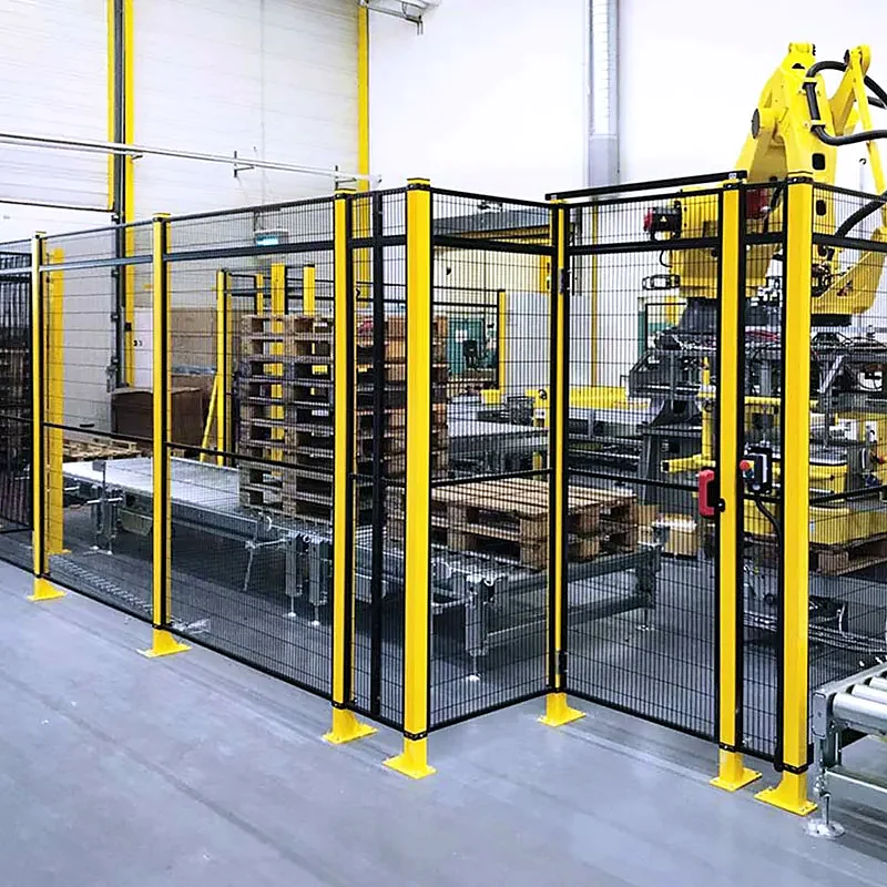 Industrial robot cell enclosed by yellow and black mesh safety guarding